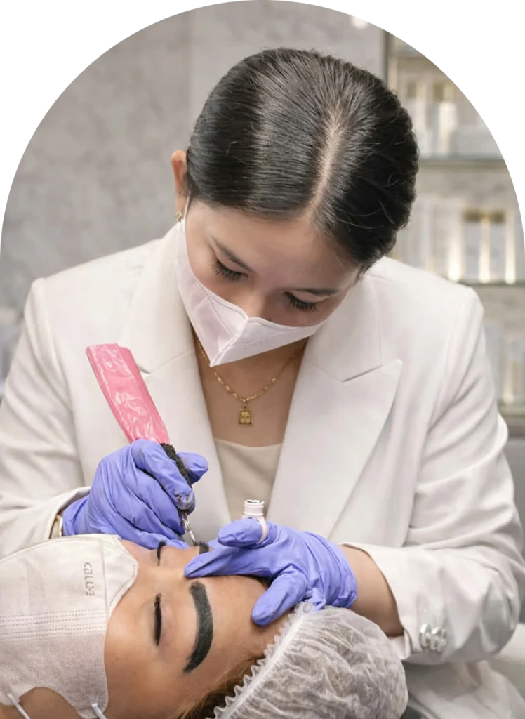 Divine Grace Alecha performing a precision nano hairstroke brow treatment at Anaura Brows International, Cebu, Philippines